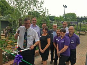 Nic Perrett cuts the ribbon at Notcutts Wheatcroft Notcutts Wheatcroft unveils spectacular Display Garden