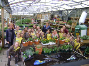 Squires brownies Brownies learn about butterfly-friendly plants at Squire’s